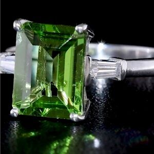 3.30ctw Peridot Gemstone & Moissainite Baguettes Rhodium Over Sterling Silver
